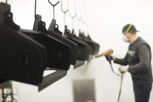 Applying black powder coat on a commercial project