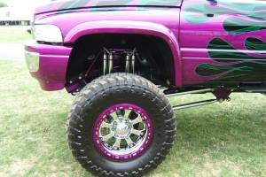 Powder coated wheel rims on a lifted truck