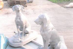 two powder coated dog statues