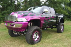 A lifted truck with various powder coated parts