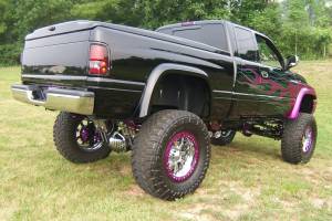 A lifted truck with various powder coated parts