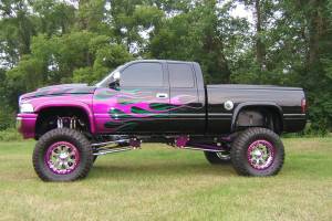 A lifted truck with various powder coated parts