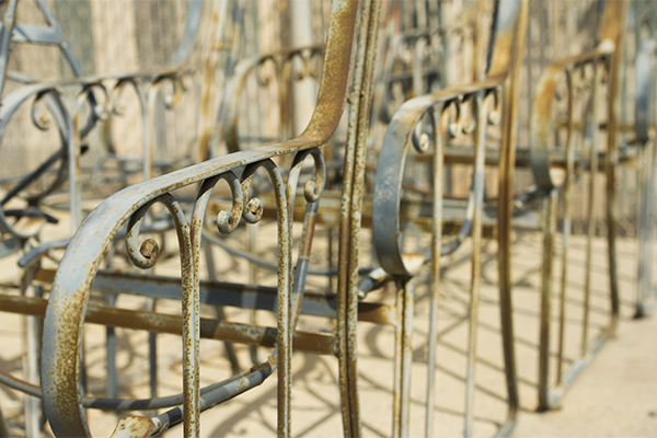 An untreated railing ready for burn-off